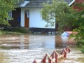 Flooded home and car, flood damaged property